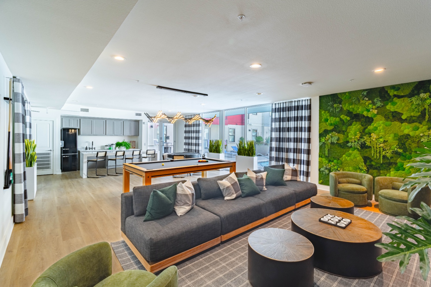 Lounge and game room with pool table at Pointe San Marcos