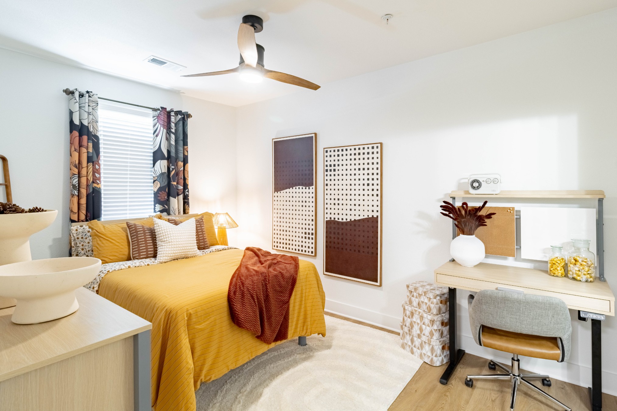 Premium model bedroom with ceiling fan and desk