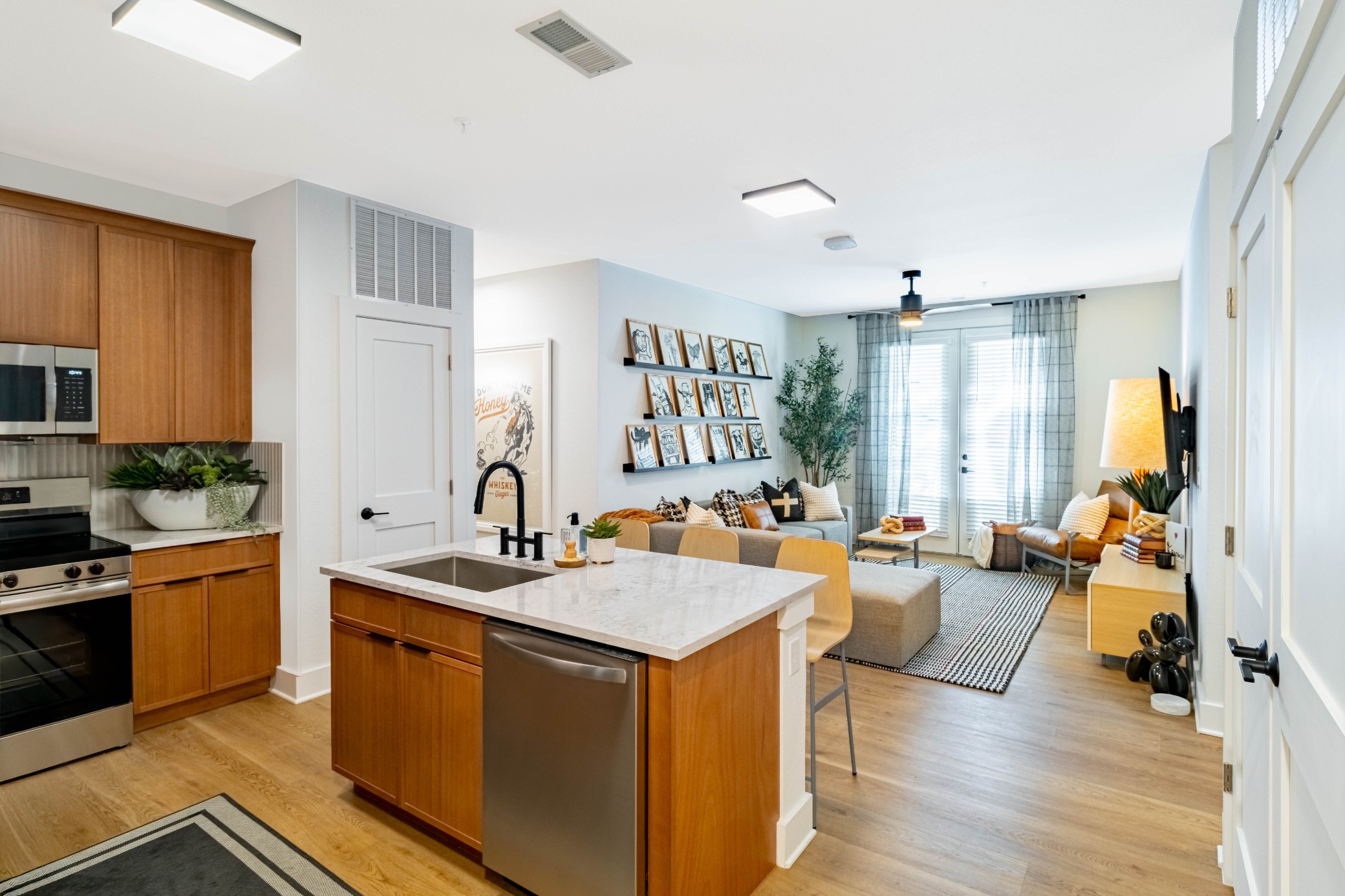 Premium model kitchen and living room at Pointe San Marcos